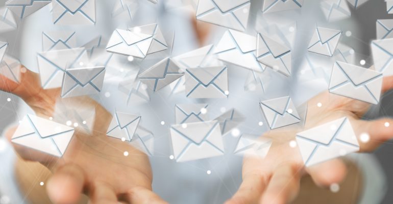 Businesswoman holding and touching 3D rendering flying email