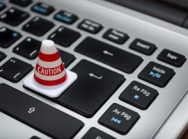 white-caution-cone-on-keyboard-211151