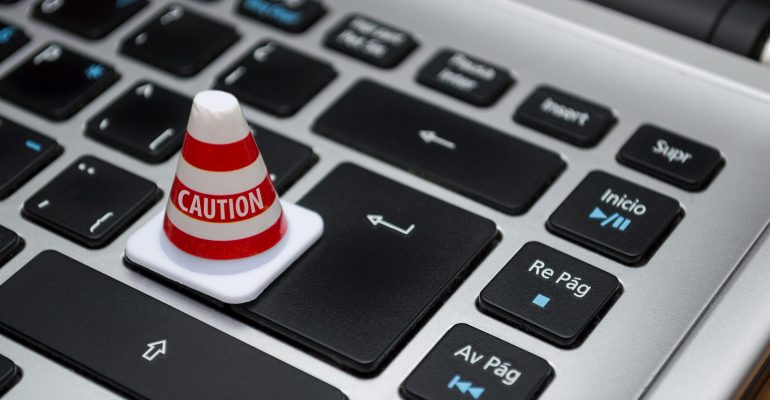 white-caution-cone-on-keyboard-211151