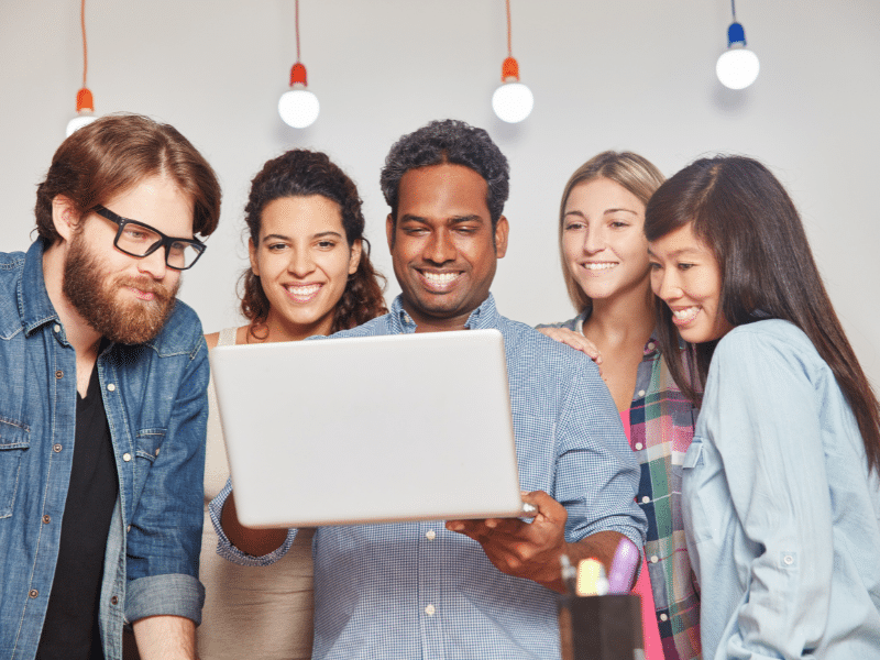 group-of-people-looking-at-a-laptop