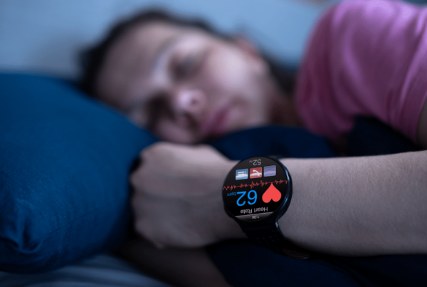 man-sleeping-with-watch-to-track-his-heart-rate