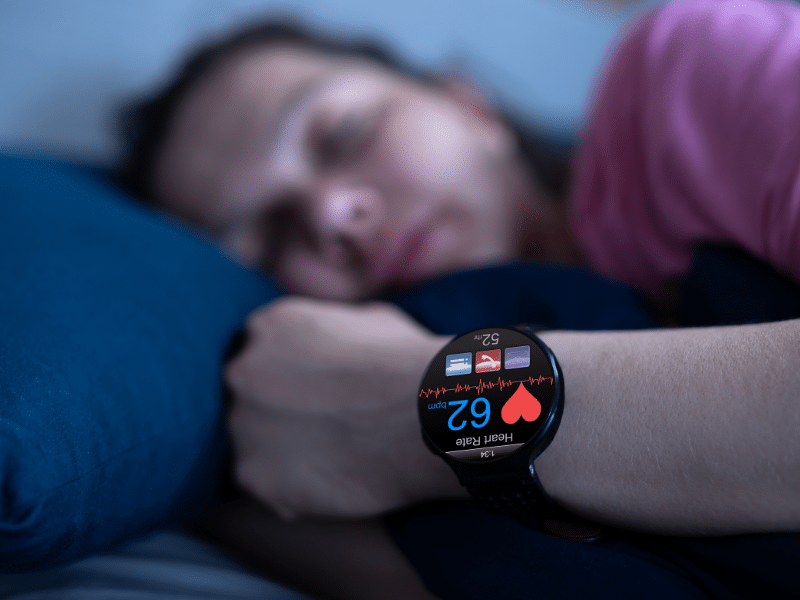 man-sleeping-with-watch-to-track-his-heart-rate