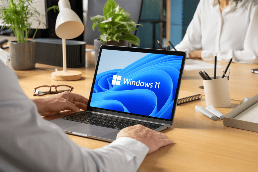 man-working-on-laptop-with-windows-11