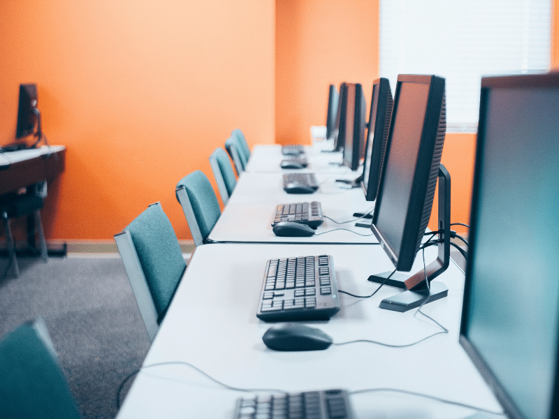 row-of-keyboards-and-monitors